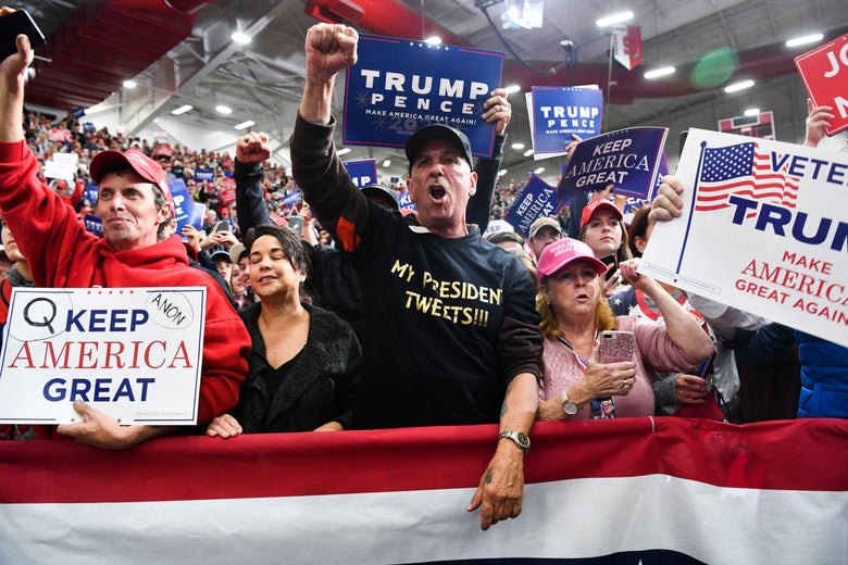 Supporters of President Donald Trump look on before he arrives for a campaign rally at Southport High School in Indianapolis, Indiana, on November 2, 2018.